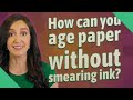 How can you age paper without smearing ink