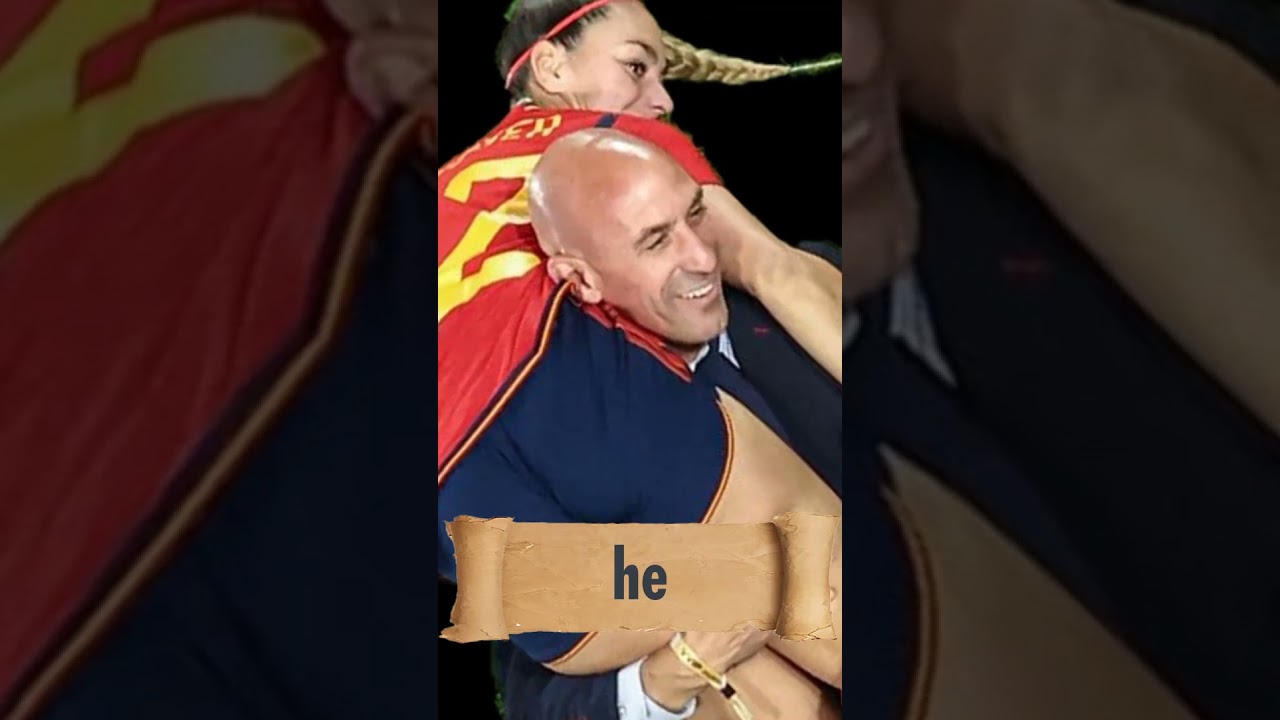 Luis Rubiales carrying Spain's Athenea on his shoulder 