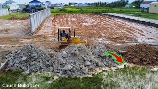 Opening small project with busy teamwork Komat'su D20P dozer pushing soil and dump trucks unloading