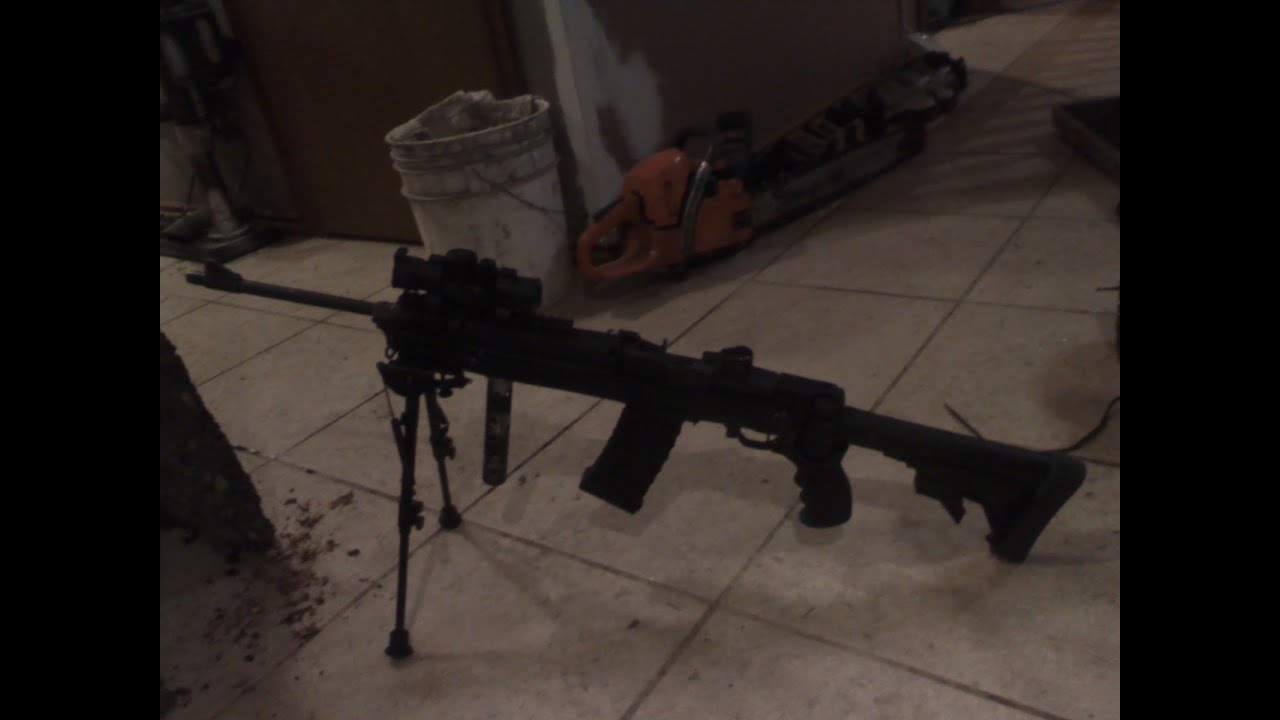 cutting tree down with a full auto rifle YouTube