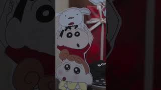 Rakhi card: A card that reads "Happy Rakhi" and has a picture of Shinchan