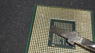 Bending Intel CPU pins to test the fragility.