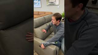 This compact leather reclining sofa has power lumbar support!