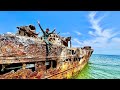 Exploring abandoned shipwreck trapped on coral reef