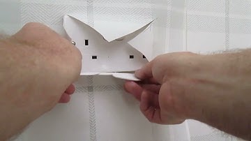 Learn how to hang wallpaper around a wall socket like a pro !
