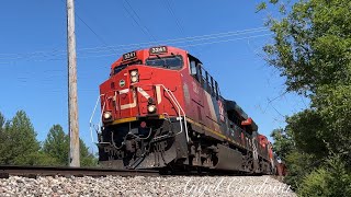 CN 3241 leads CN M337 with 2 CN 100 units through Glendale Heights, IL on 5/25/2024