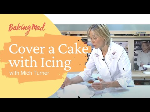 how-to-cover-a-cake-with-ready-to-roll-icing-|-baking-mad