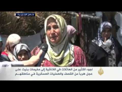لجوء العائلات باللاذقية إلى مخيمات بنيت من القش
