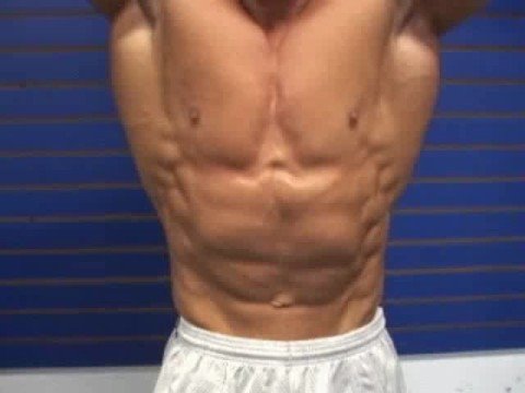 Bodybuilder Craig Torres posing abs in gym