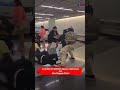 🚨 CHAOS AT AIRPORT: Massive Fight Breaks Out Near Baggage Claim! #airport #fighting #viral #ytshorts