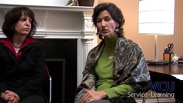 What is service-learning and how is it different from volunteering?