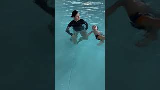 10 month old baby during 6th week of Infant aquatics class