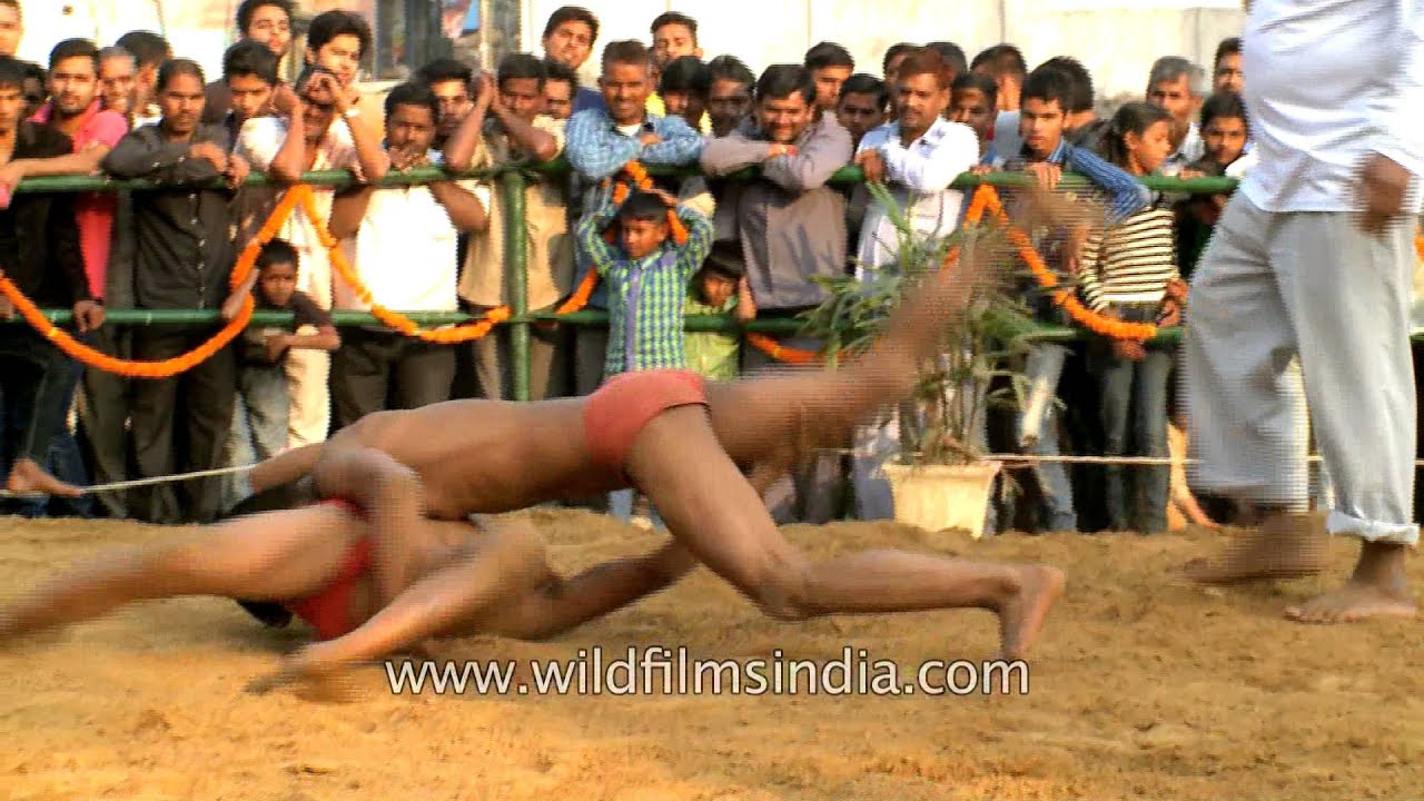 Young and enthusiastic wrestlers fight in slow motion