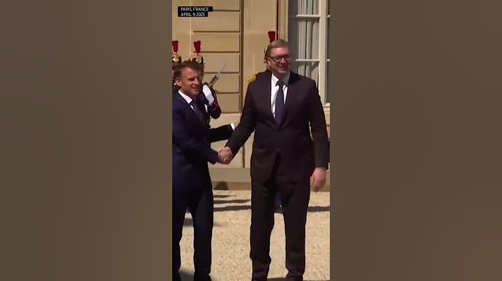Macron greets Serbia’s Vucic in Paris
