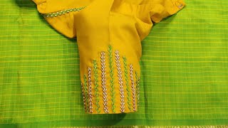 Thread and bead work on stitched blouse