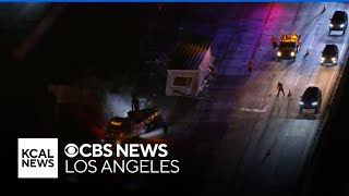 Cleanup continues after big rig drops modular building on 210 Freeway