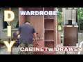Ref:7v8eFVInD4Y Wardrobe cabinet with drawer and hanging rod.