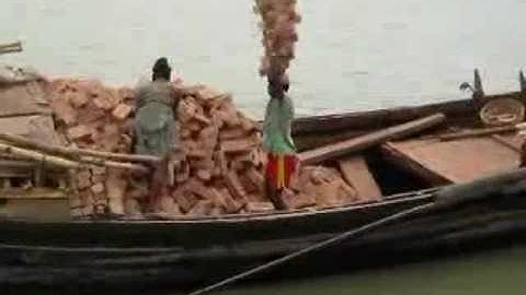 Unloading bricks in  Bangladesh