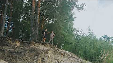 Hikers talk about scenery, Two explorers venture cliff area, Group of hikers examines forested