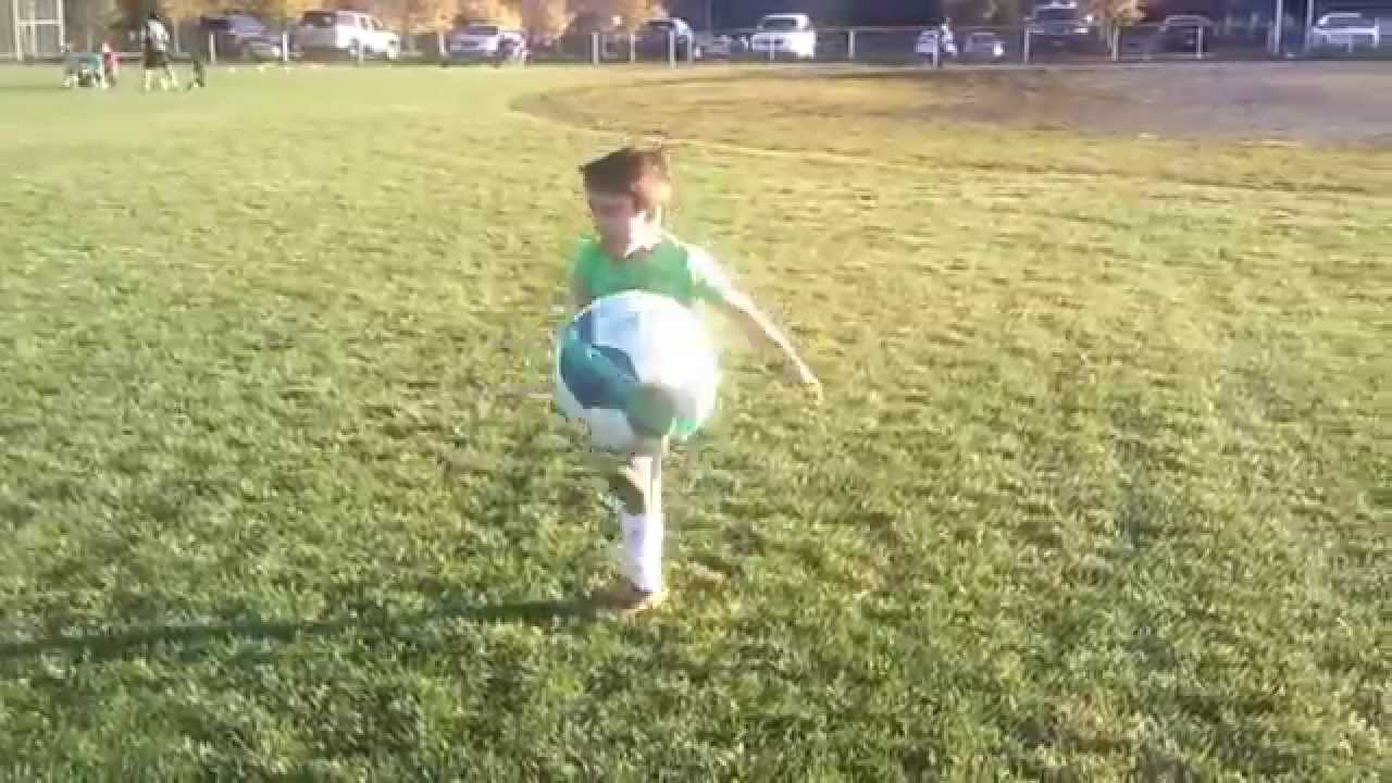 Miles learns how to dropkick a soccer ball YouTube