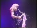 Dave mustaine gets an oversized bra thrown at him from the audience