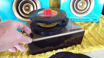RCA J-2 45 RPM, 7" record changer playing a stack of records.