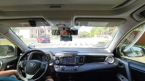 Self-driving Toyota RAV4 stopping at a stop sign