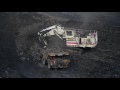 Terex Mining Excavator Loads CAT Haul Trucks