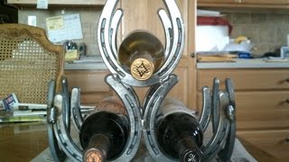 Here I have a step by step video on how to make a 3 bottle wine rack out of horseshoes.