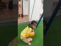 Kid playing on swing