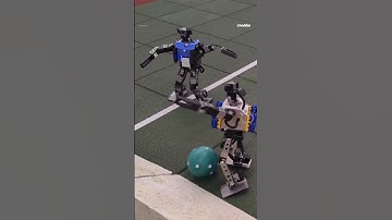 Watch mini AI robots play soccer