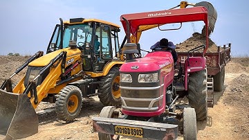 Jcb 3dx backhoe loader loading mud in mahindra 415DI YUVO tractor and Swaraj 843XM tractor trolley