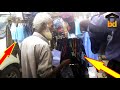 ►70+ Years Old Grandpa Selling Special Wearing Cloth Standing at Roadside-Necessary Elements Seller