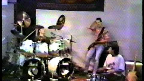 Tommy Emmanuel, playing the drums with Doane Perry...