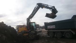 Volvo EW160e Loading Rocks