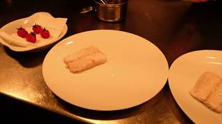 Chef Gary Kirchens prepares a seabass dish in star restaurant La Villa Lorraine Brussels, Belgium