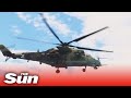 Russian attack helicopter destroying Ukrainian armoured vehicles