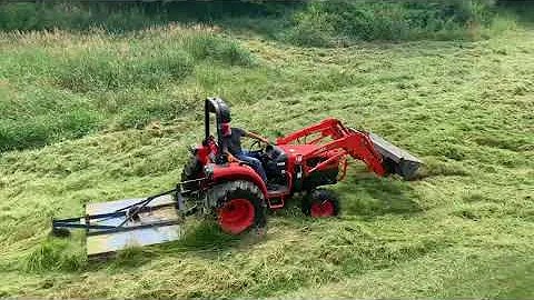 Kioti DK40 tractor bush hogging