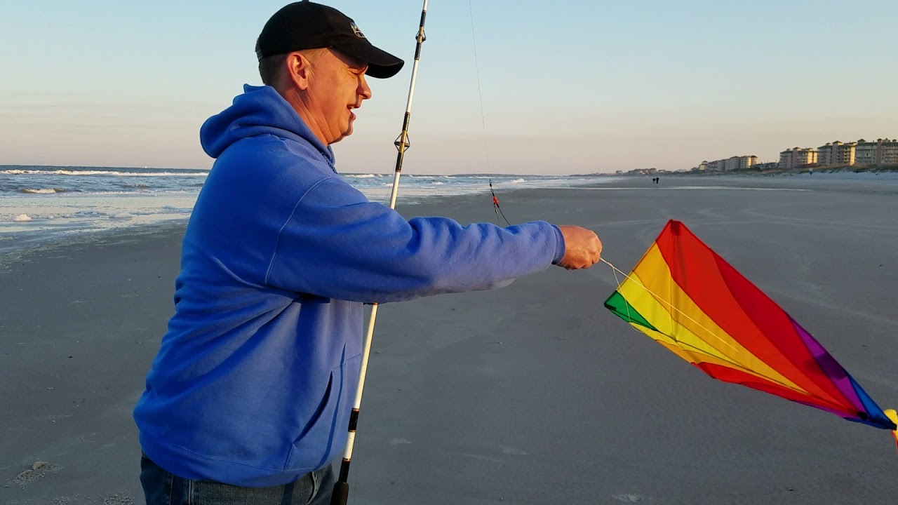 Fly a kite using a fishing pole. 