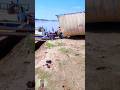 Tractor with overload trolley river crossing with boats river for water supply farming in sindh