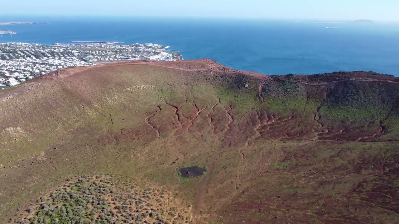 Flight over a volcano crater - Montaña Roja, Lanzarote