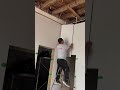 the stage of installing a plywood wall by nailing it to a wooden frame that is made#shorts