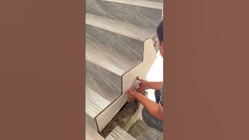the process of installing ceramic tiles on the stairs of the house #construction #ceramic #stairs