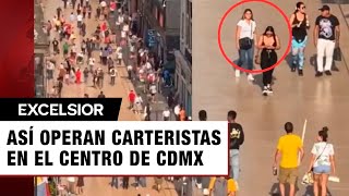 Momento exacto en que carteristas roban en la calle Madero de la CDMX
