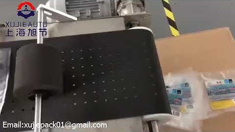 Auto plastic bag separation  labeling machine from XUJIE AUTOMATION MACHINERY