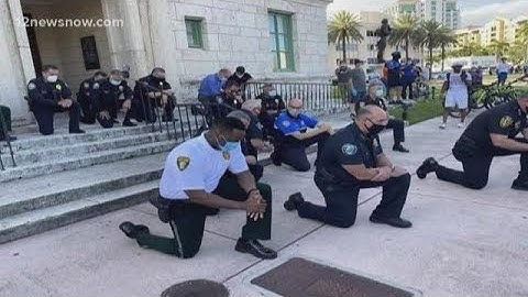 'Walk with us,' Powerful images of unity come out of peaceful protests across US following George Fl