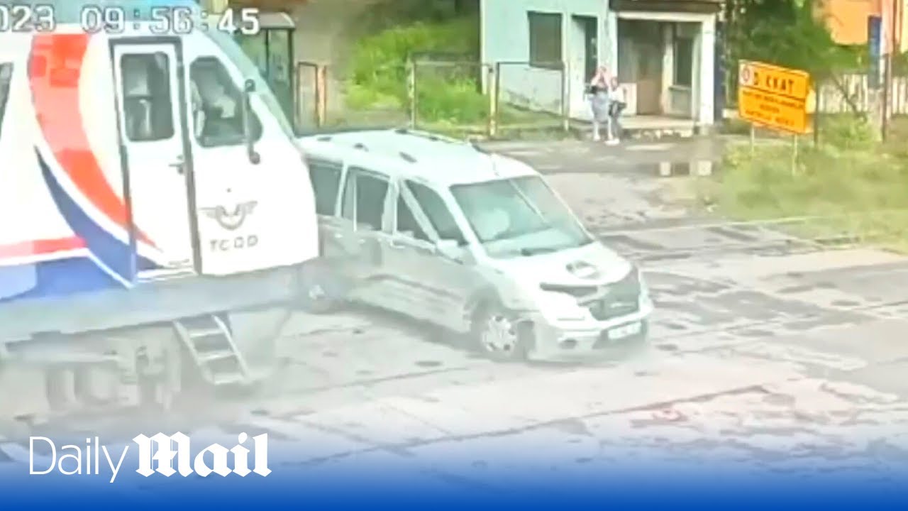 CCTV footage of the terrifying moment a train collides with car at railroad crossing in Turkey