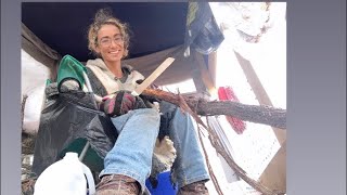 Whittling cedar wood for a walking stick and for fire tender