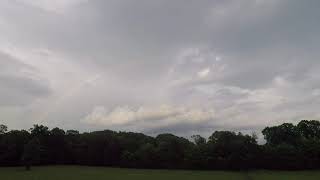 Time lapse video of clouds and rainbow.