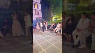 Bonfire group dance girls and boys at dinner time in front of River west hotel in Manali Kullu .